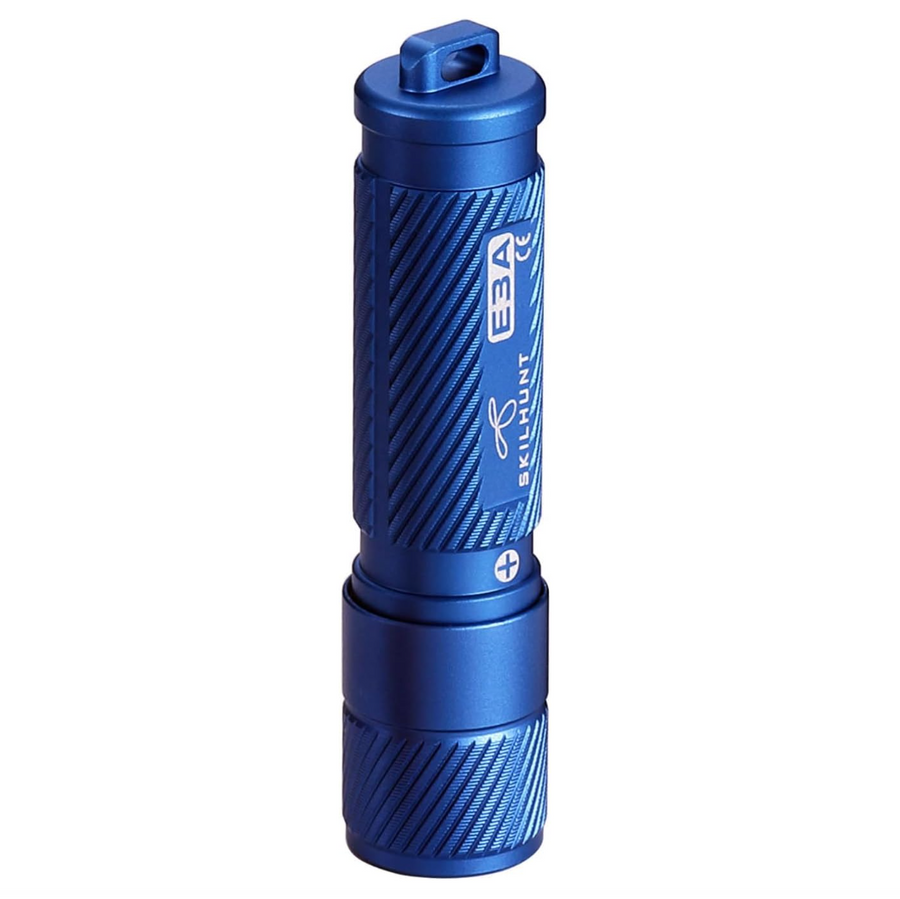 Blue flashlight with textured surface on a white background