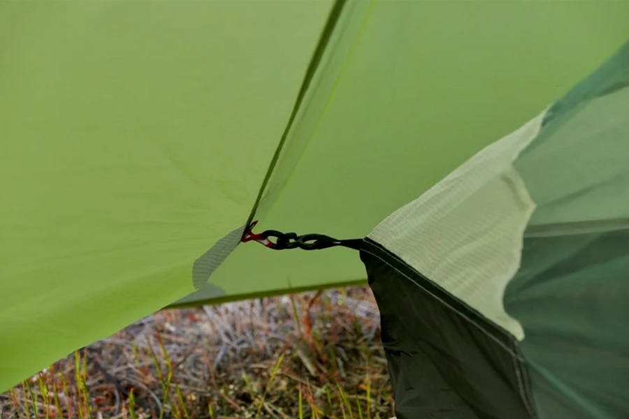 Close-up of a green tent with a blurred natural background