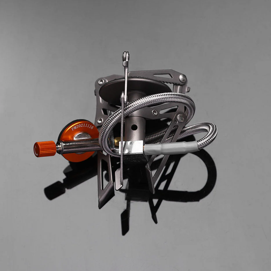 Portable camping stove on a gray background