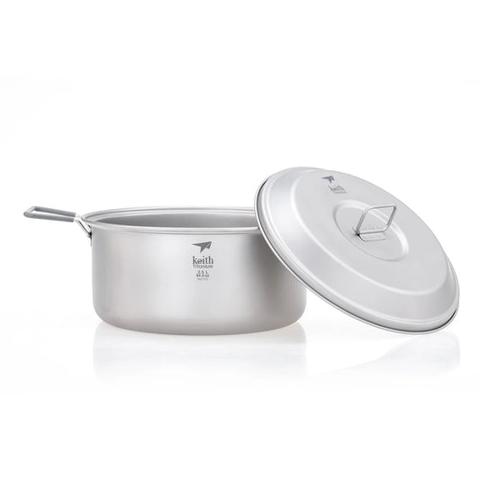 Camping pot with lid on a white background