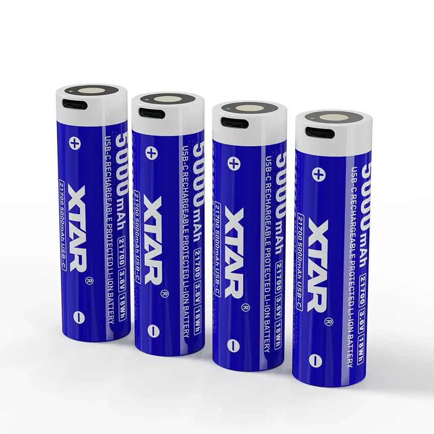 Four Xtar batteries with blue and white design on a white background