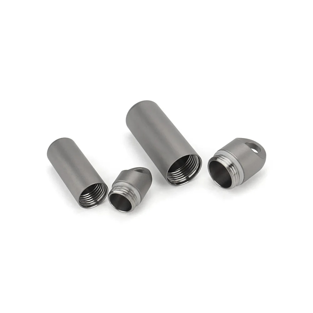 Four metallic cylindrical components on a white background
