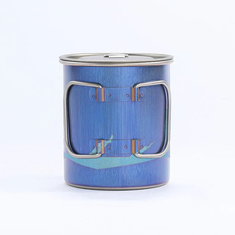 Blue metal mug with a handle on a white background