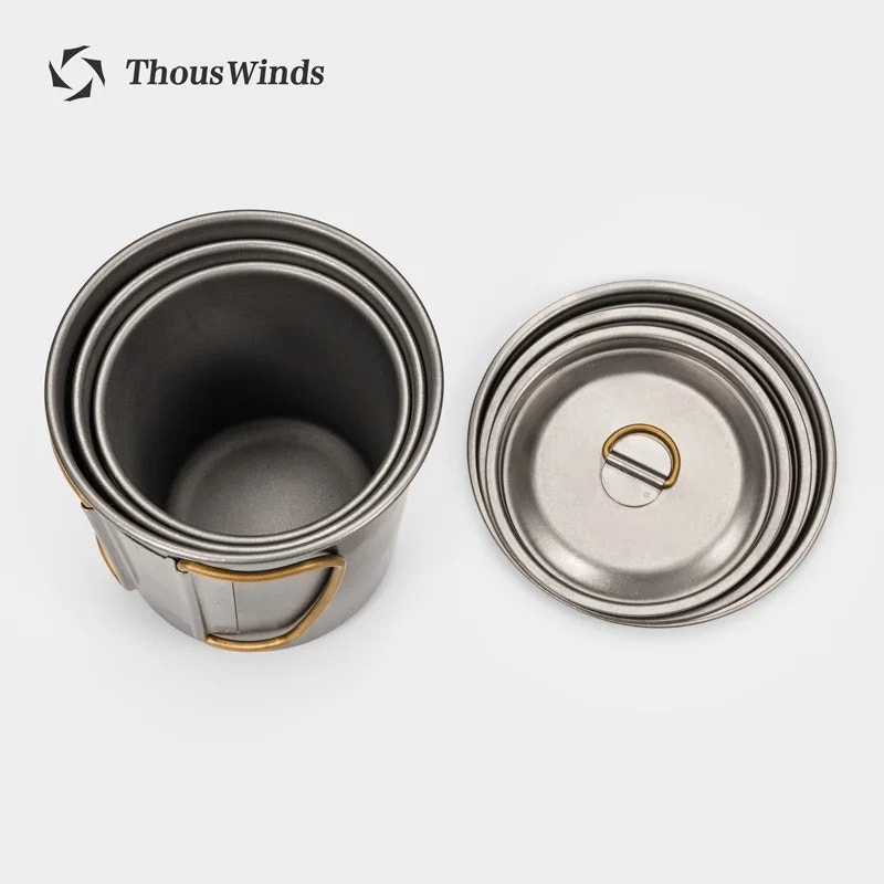 Titanium mugs with lids on a white background, featuring the ThousWinds brand.