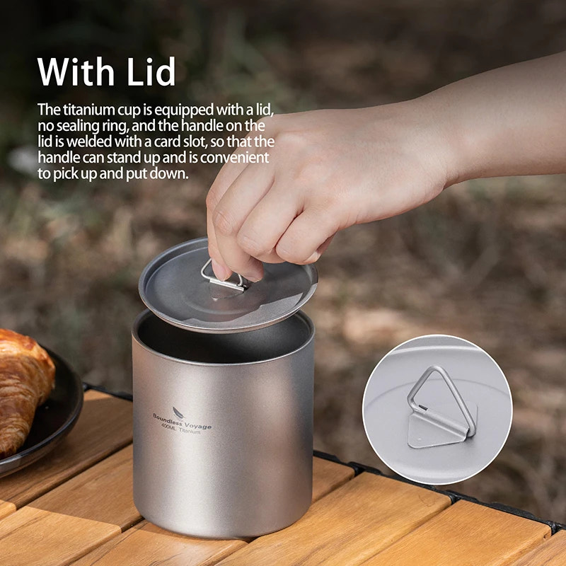 Titanium cup with lid being opened on a wooden surface, with text explaining its design.