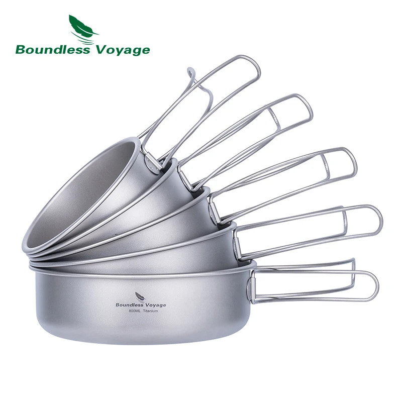 Stack of silver camping cookware with 'Boundless Voyage' branding on a white background