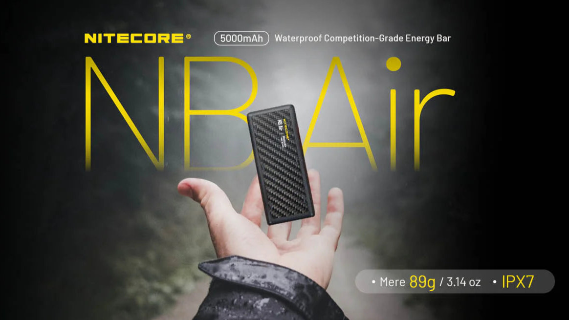 Nitecore NB Air energy bar held in a hand with product details on a dark background