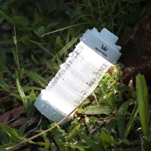 small lantern laid on grass
