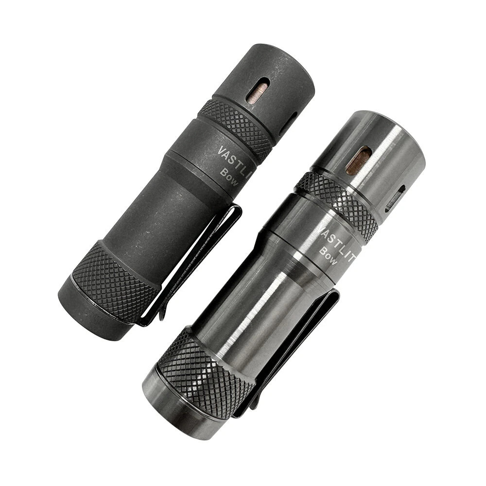 Two flashlights, one black and one silver, on a white background