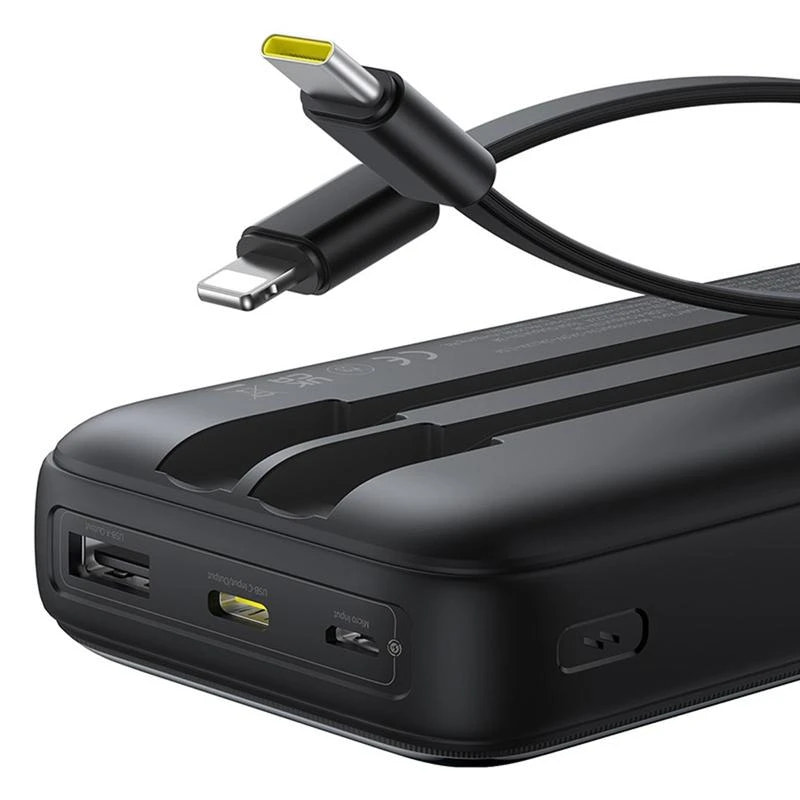 Black power bank with multiple ports and a cable on a white background