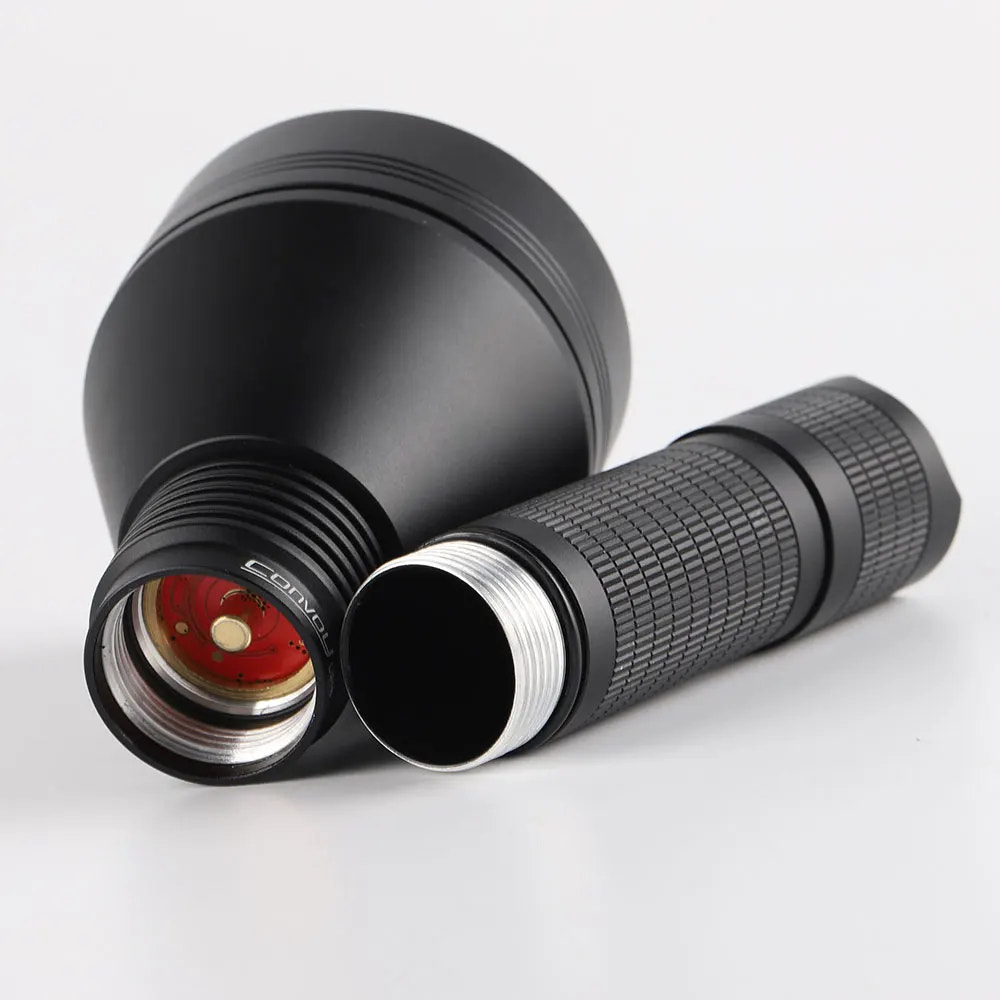 Black flashlight with textured grip on a white background