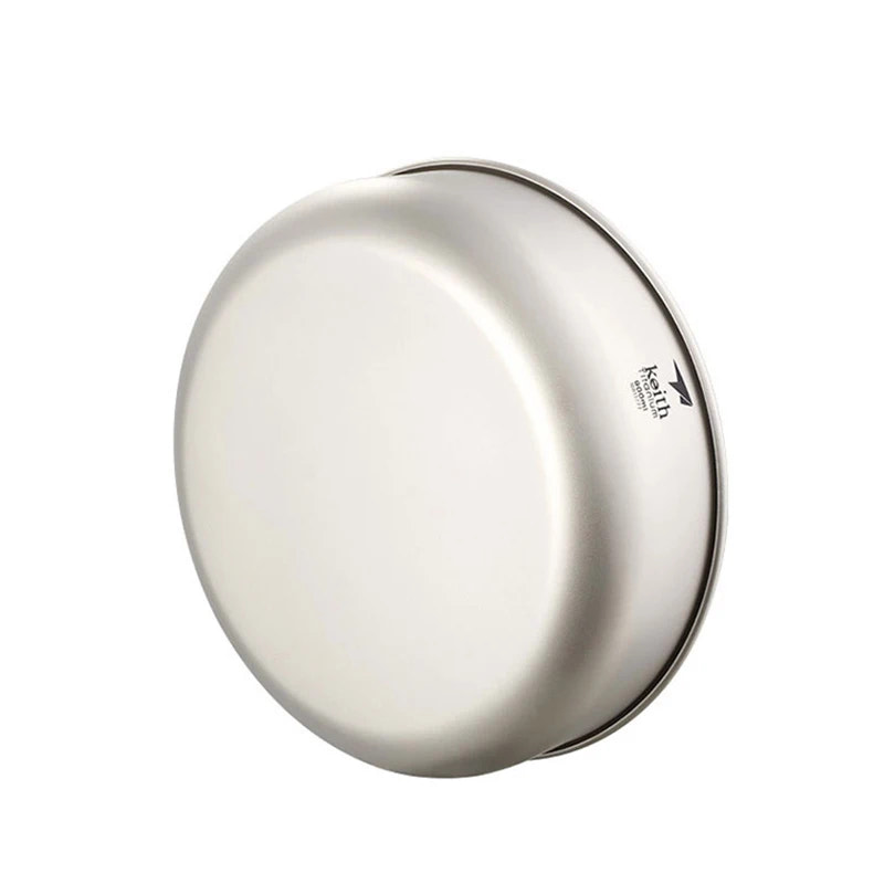 Round metallic object with a brand logo on a white background