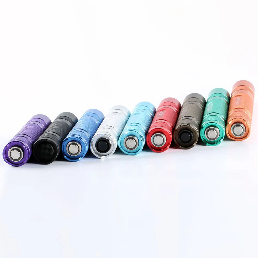 Row of colorful flashlights on a white background
