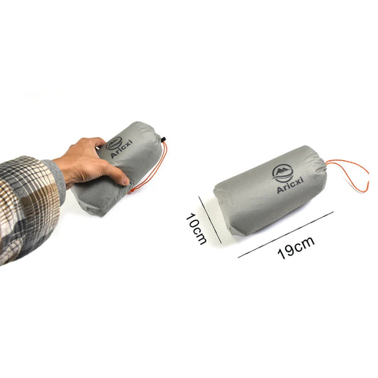 Gray inflatable pillow with Aricxi branding, held by a person, on a white background with measurements shown.