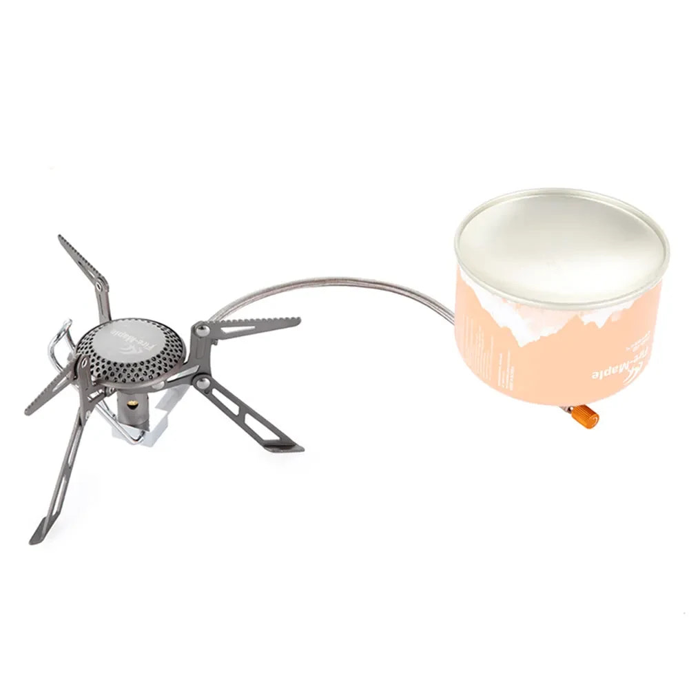Portable camping stove with a white cup on a white background