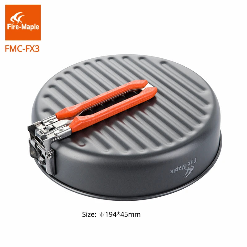 Gray camping cookware set with orange tongs on a white background, featuring Fire-Maple branding.