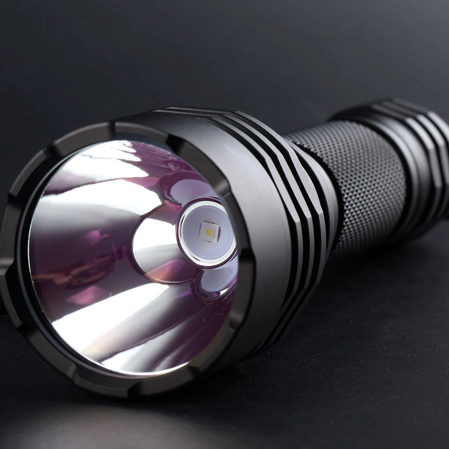 Close-up of a flashlight on a dark background