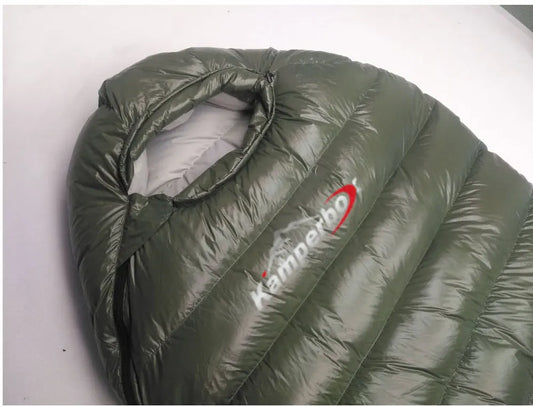 Green sleeping bag with Kamperbox logo on a white background