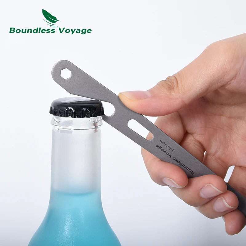 Hand using a metal bottle opener on a bottle with 'Boundless Voyage' branding.