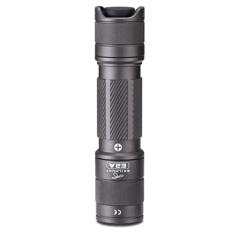Gray flashlight with visible brand logo on a white background