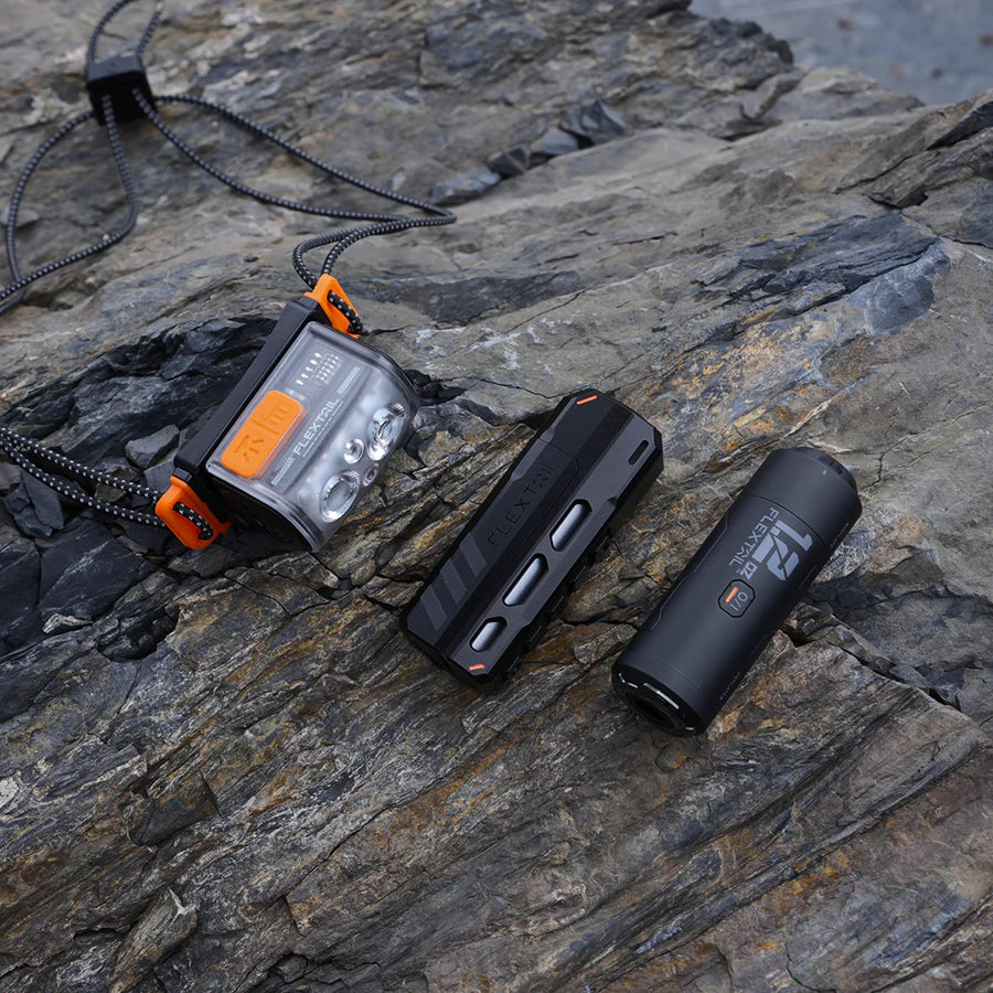 Three outdoor devices on a stone surface