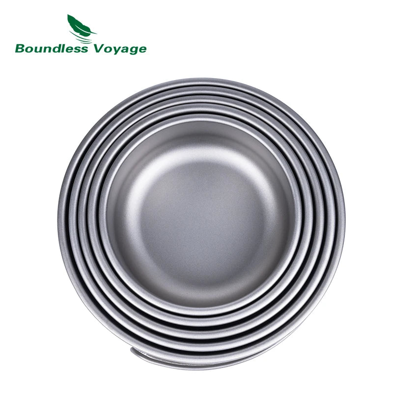 Set of metallic bowls stacked on a white background with 'Boundless Voyage' branding.