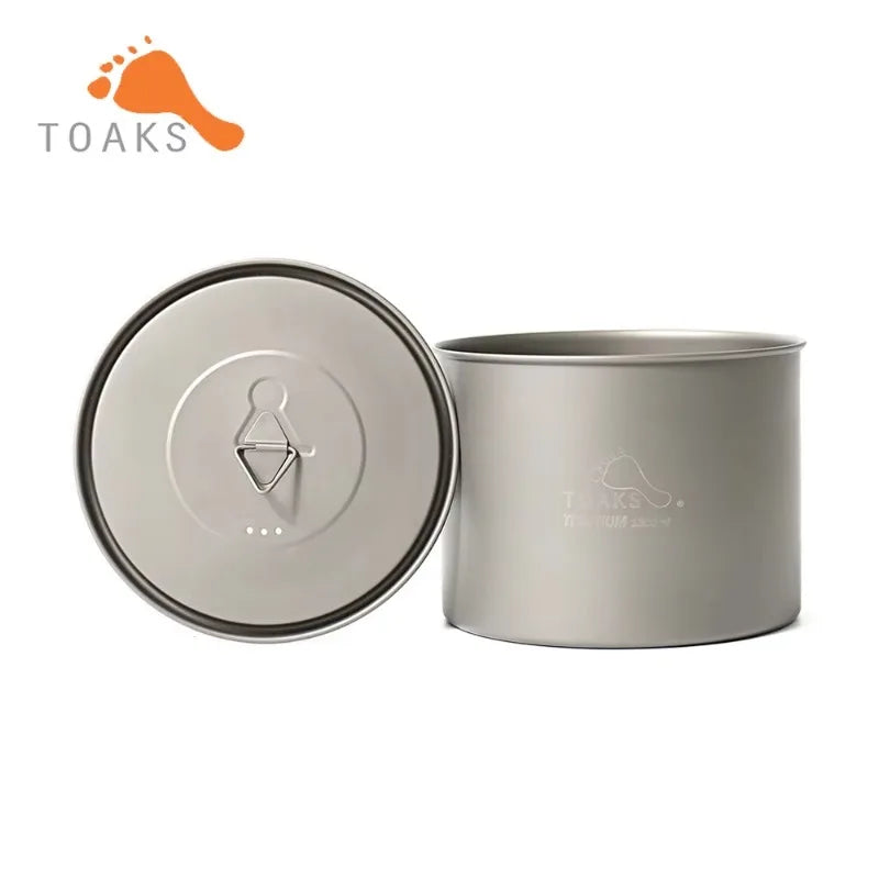 Titanium camping pot with lid on a white background, featuring the Toaks brand.