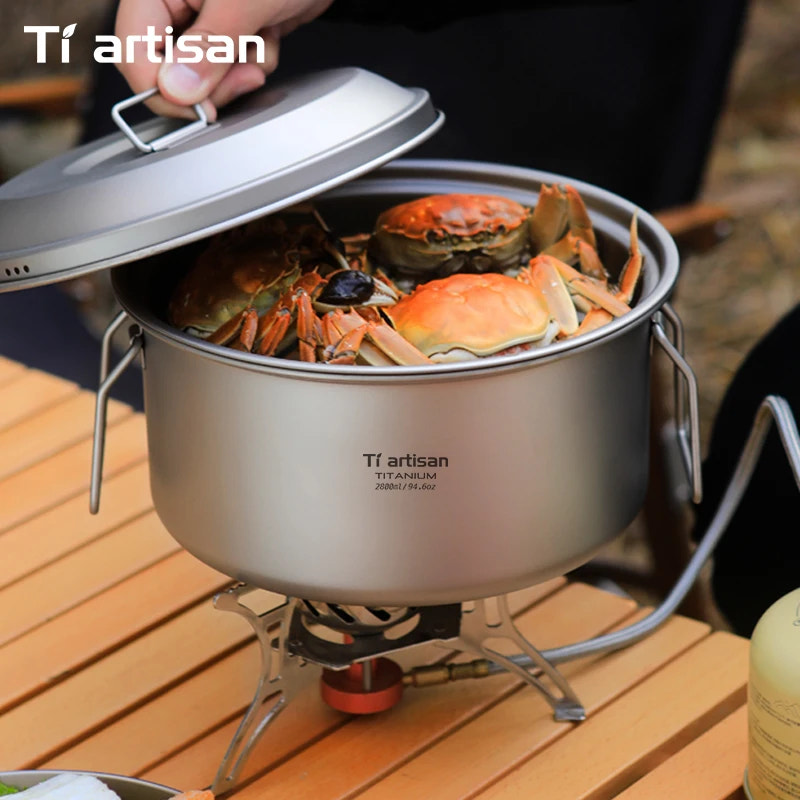 Tiartisan titanium pot with crabs on a wooden surface
