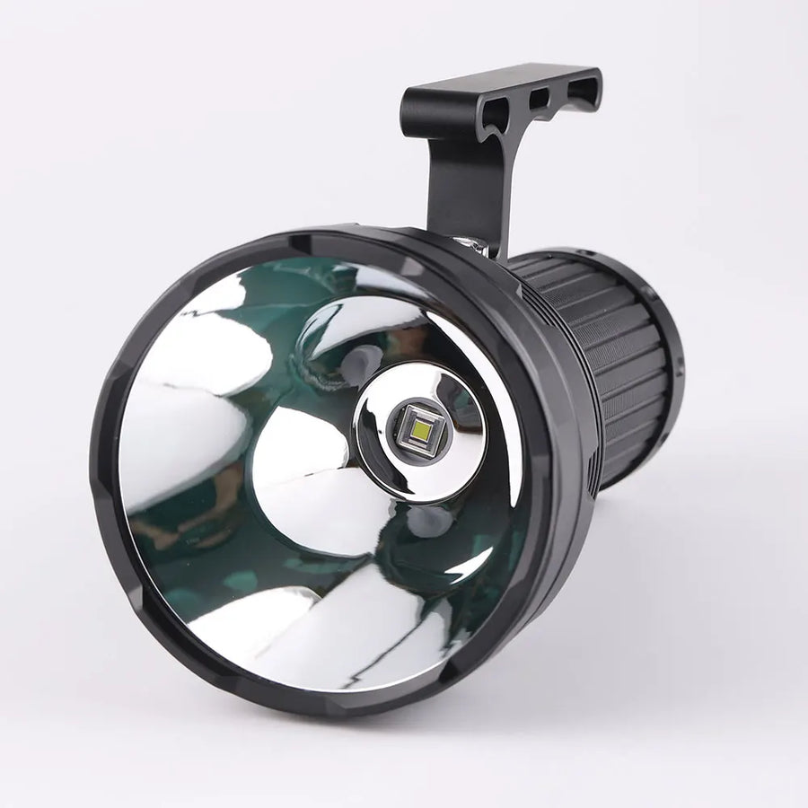 Black flashlight with reflective surface on a white background