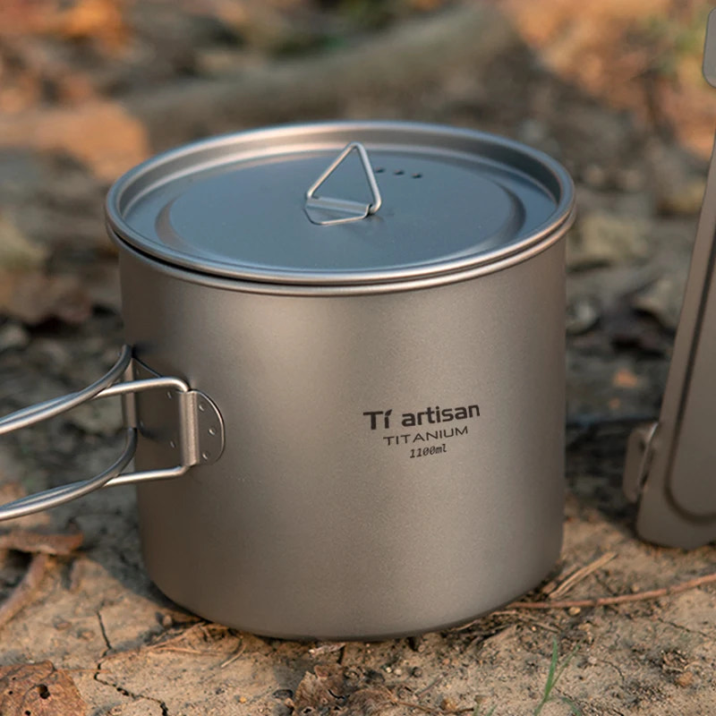 Titanium cook pot with lid on a natural background