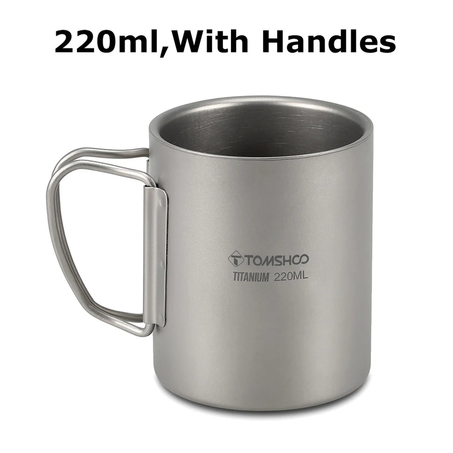 Titanium mug with handles and 'Tomshoo' branding on a white background