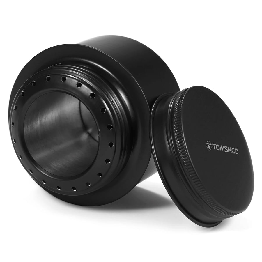 Black metal container with lid on a white background