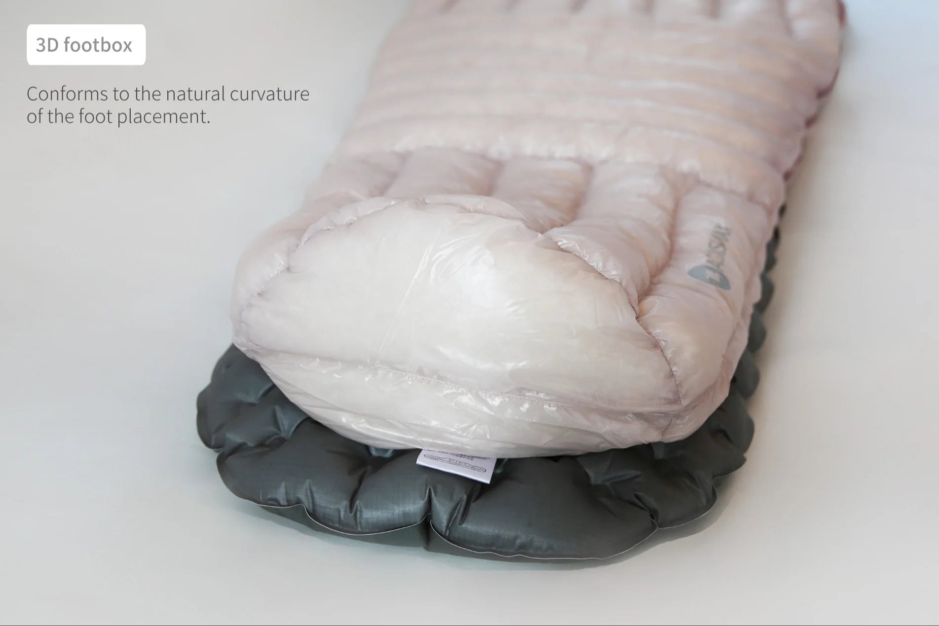 Close-up of a sleeping bag with a 3D footbox design on a white background.