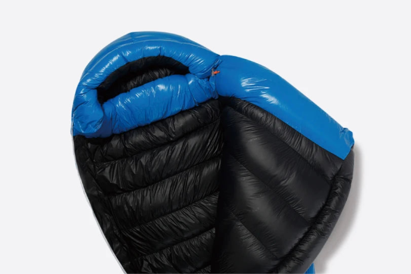 Black sleeping bag with blue interior on a white background