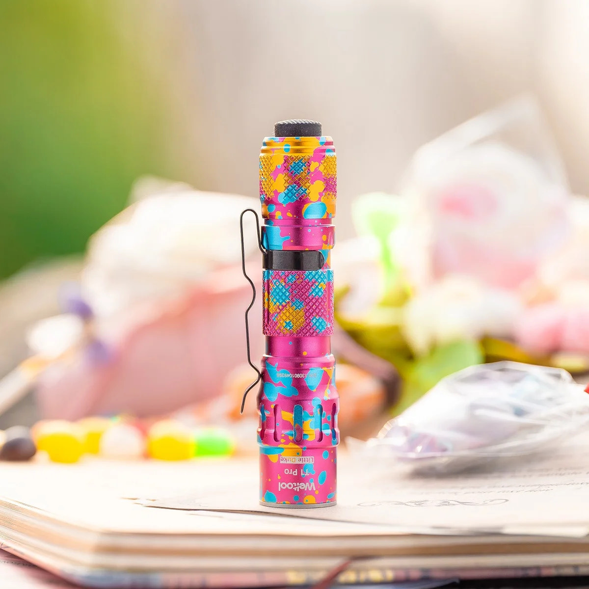 Colorful flashlight on a surface with a blurred background