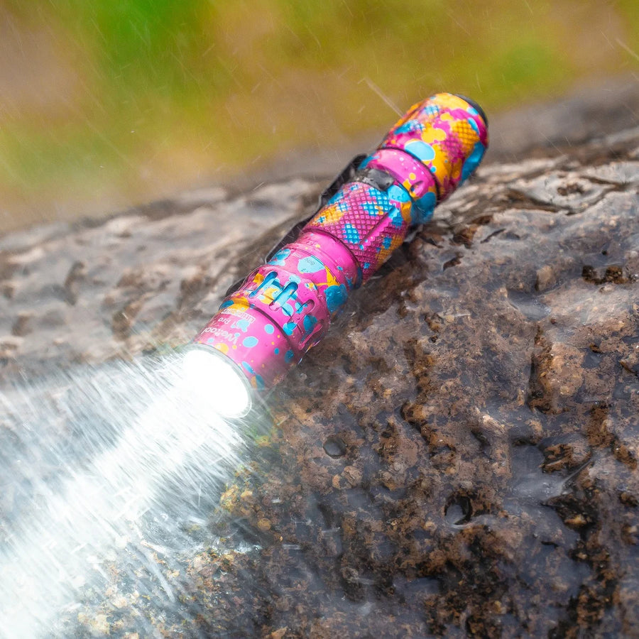 Colorful flashlight on a rock with a blurred natural background
