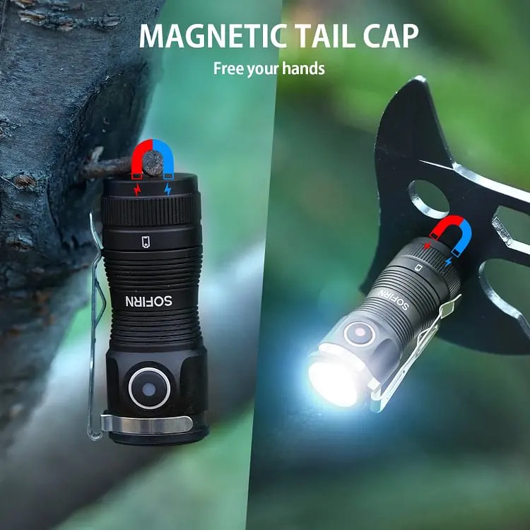 Black flashlight with magnetic tail cap attached to a tree, showing light emission.
