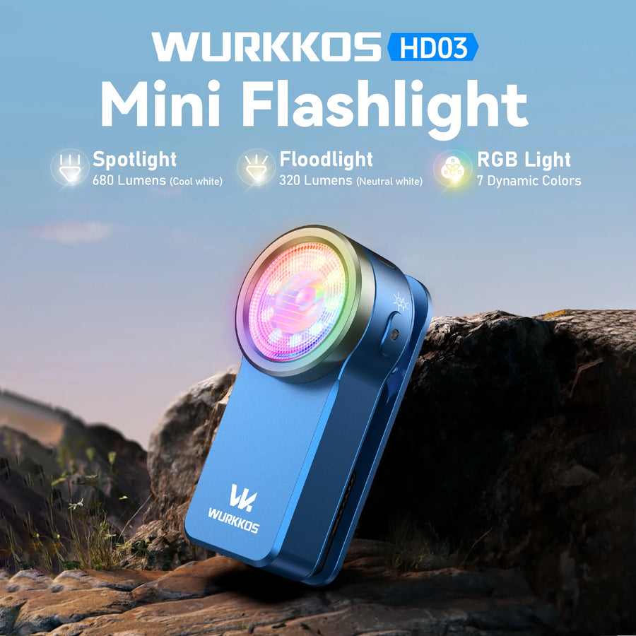 WURKKOS HD03 Mini Flashlight with RGB light feature on a natural background