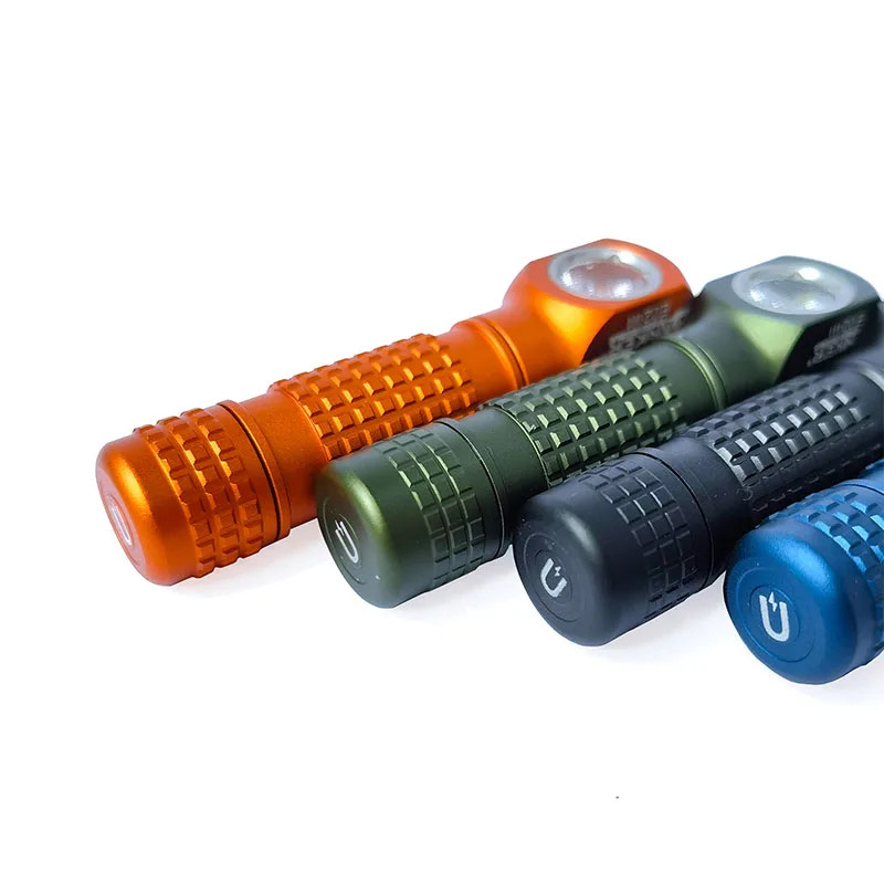 Four flashlight handles in orange, green, black, and blue on a white background