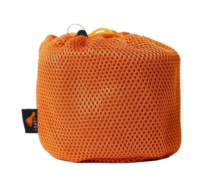 Orange mesh bag with a visible brand tag on a white background