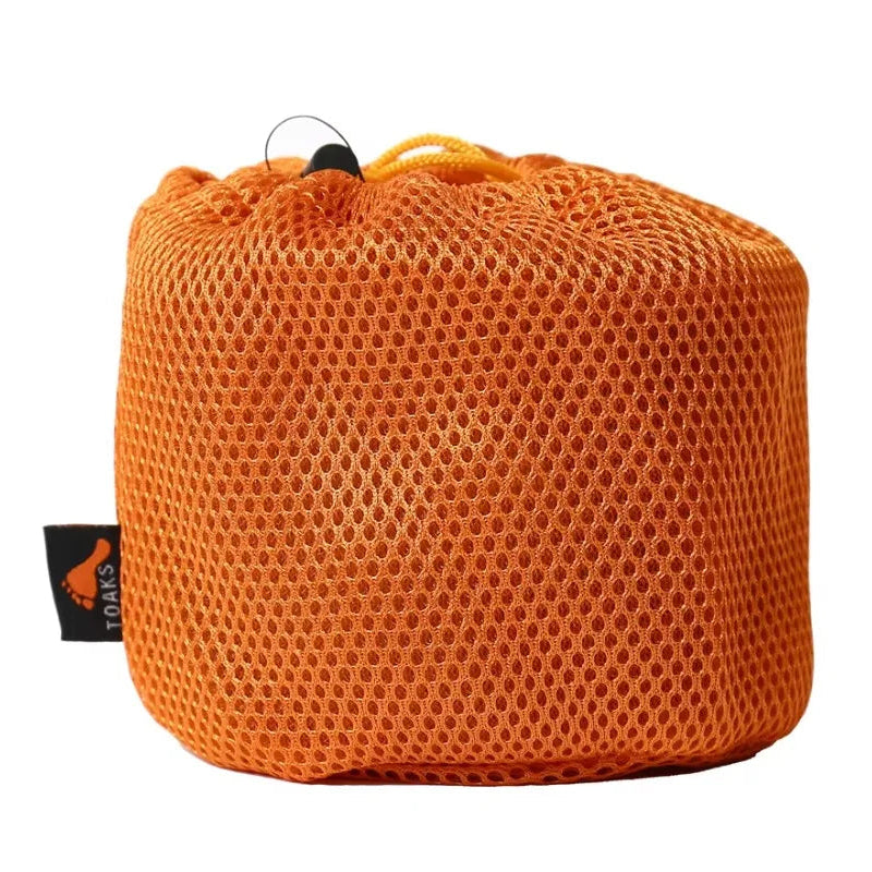 Orange mesh bag with a visible brand tag on a white background