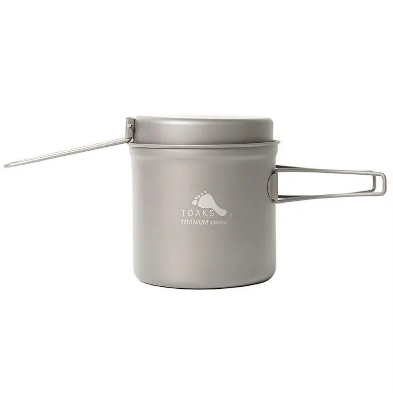 Titanium cookware set with lid and handles on a white background