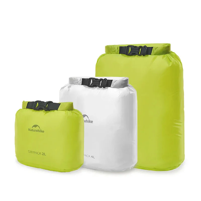 Three green and white dry bags with 'Naturehike' branding on a white background