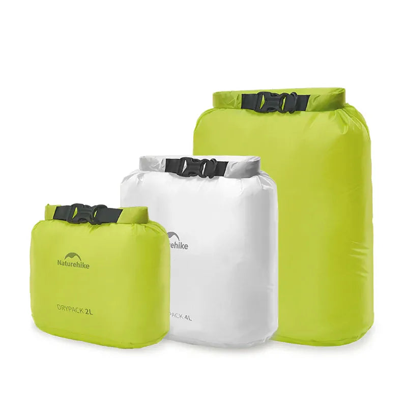 Three green and white dry bags with 'Naturehike' branding on a white background