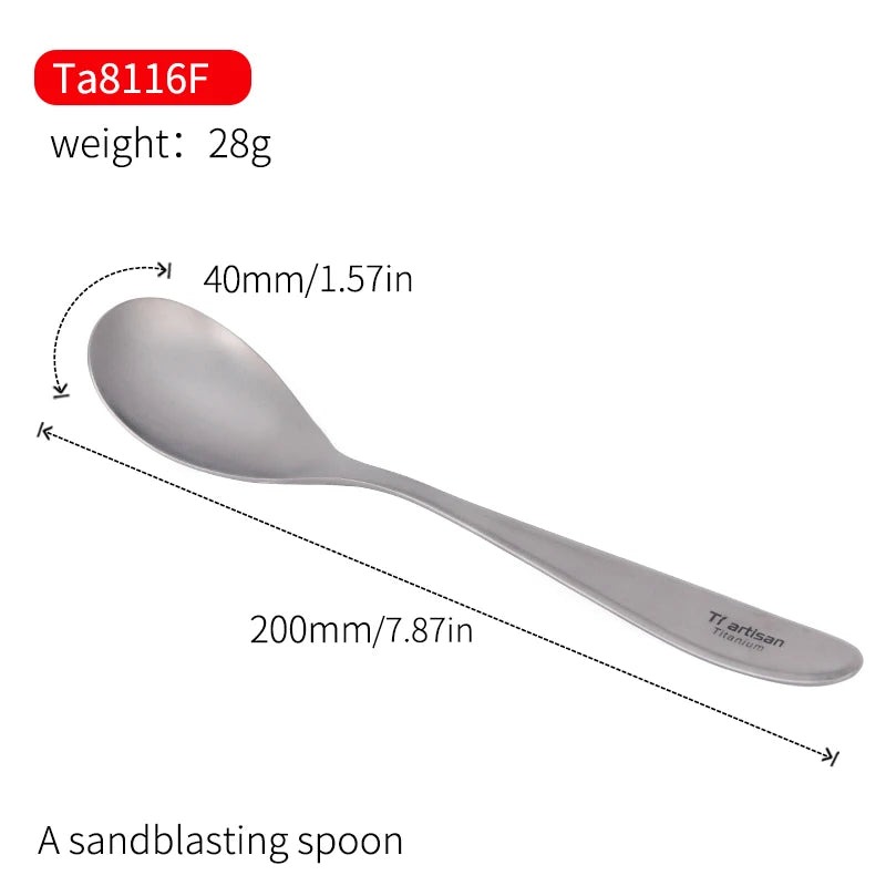 A polished titanium spoon and fork placed on a wooden board with a lemon and garlic in the background.