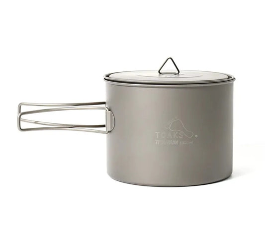 Titanium cook pot with lid on a white background