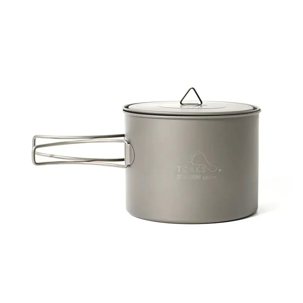 Camping pot with lid on a white background