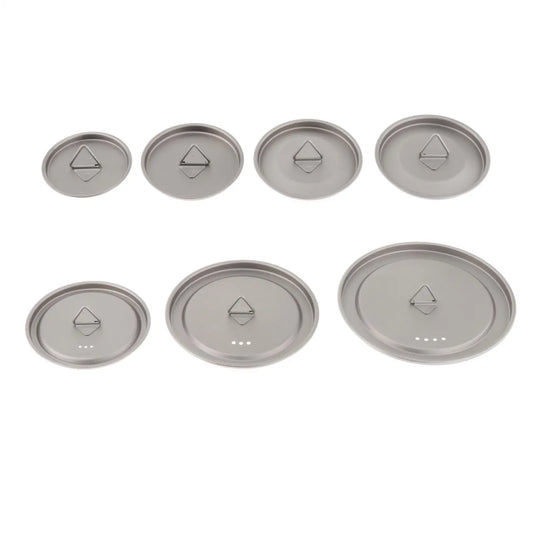 Set of eight metallic lids with geometric symbols on a white background