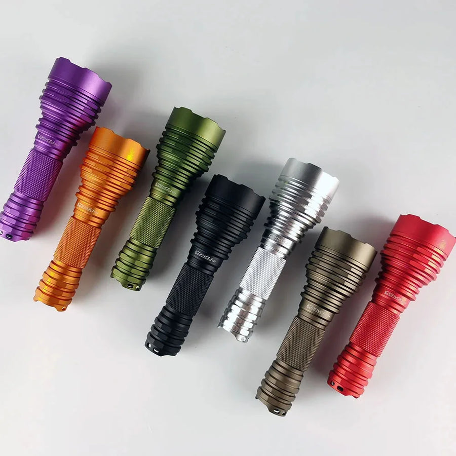 Seven flashlights in different colors arranged on a white background