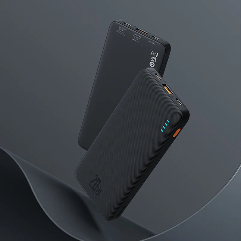 Two black power banks on a dark gray background